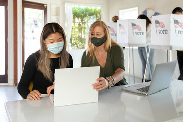 Older Poll Worker Training New Worker at Polling location