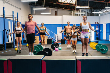 Group of athletes jumping with ropes