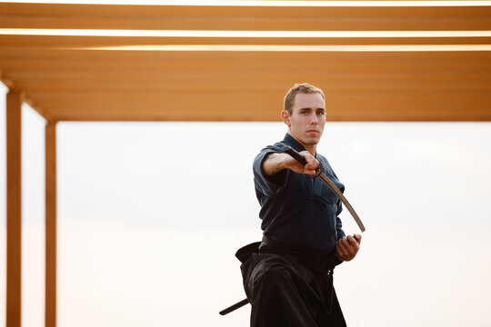 Samurai practicing with sword in gazebo