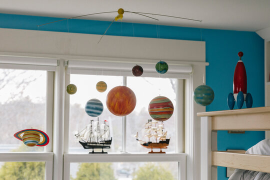 Solar System Mobile in Child's Bedroom with Rocket