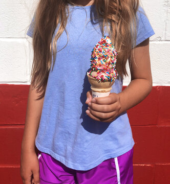 Girl Holding Sprinkled Ice Cream Cone