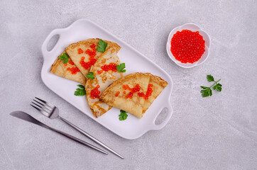 Fried crepes with red fish roe