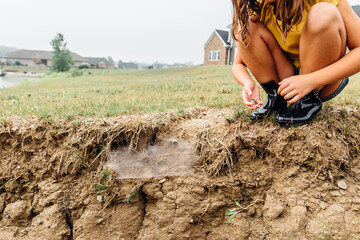 Curious child discovering spider web.
