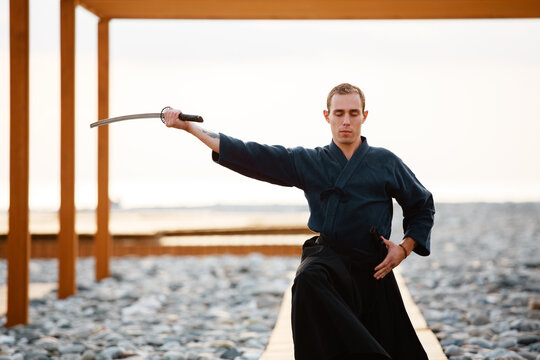 Samurai taking sword from scabbard