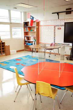 Empty elementary school classroom ready for receiving students with all coronavirus safety measures.