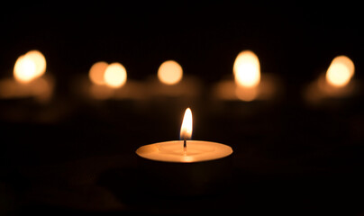 candles that are lit in the dark