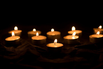 candles that are lit in the dark