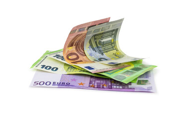 Heap of euro banknotes isolated on white with light shadow