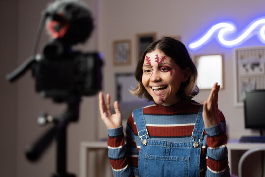 girl with a costume recording a halloween video