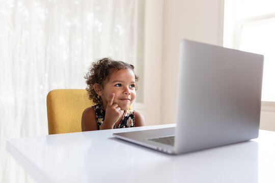 Little Girl Thinking During an Online Class