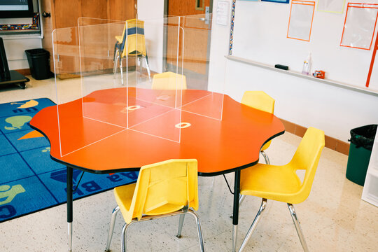 Empty elementary school classroom ready for receiving students with all coronavirus safety measures.