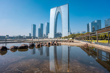 Modern skyline with a reflection in Suzhou, China.