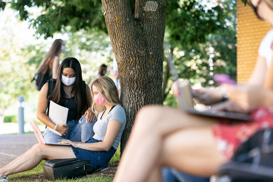 Covid: Friends Discuss Online Classwork While Wearing Masks