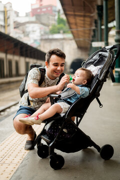 Father and son on a platform.