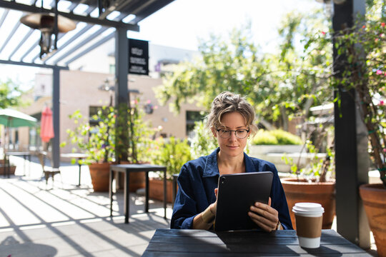 Woman Using a Tablet for Work