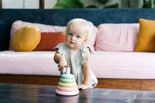 Cute baby with toy ring tower