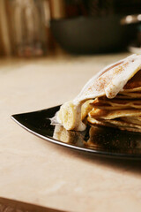 Homemade tasty panckes with white ice-cream and bananas
