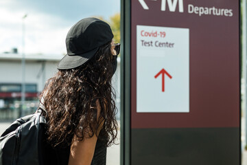 Woman looking for COVID-19 Test Center