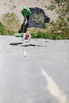 Adventurous Woman Rock Climbing Outdoors