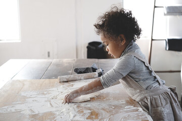 a girl baking cookies 