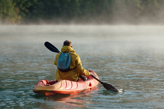 Man Paddling In A Canoe