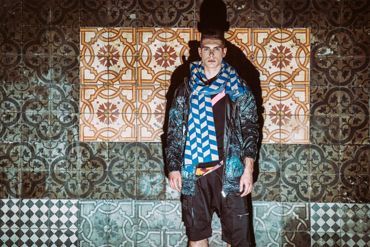 fashion in front of an old tiled wall