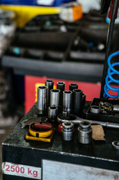 Tools placed on battery in garage