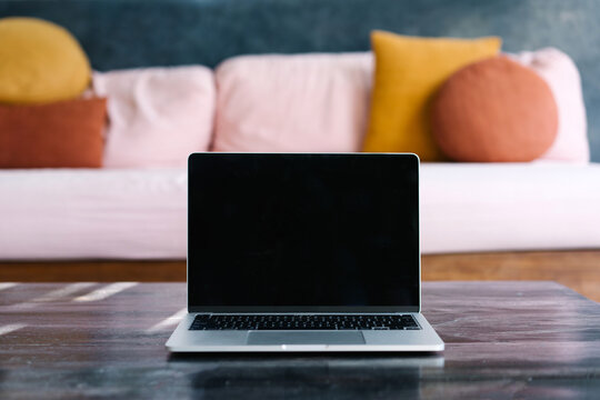 Laptop on table in living room