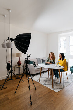 Ethnic women recording podcast together