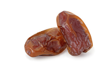 Two dried dates isolated on white