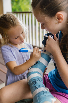 Friends With Cast on Broken Arm