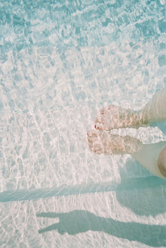 Feet In Water With Peace Sign Shadow