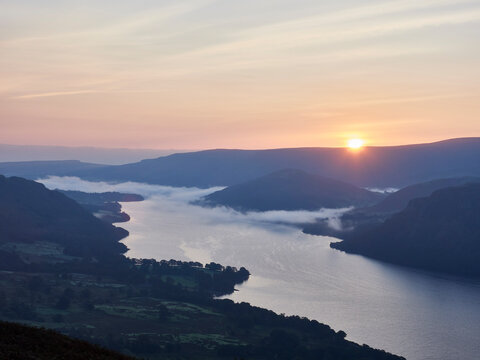 Sunrise and cloud inversion over Ullswater. Lake District, Cumbria, UK.