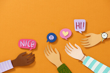 Multi colored speech bubbles on the fingers of the hand