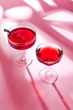 Two Raspberry Cocktails in Patterned Light