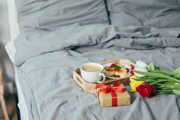 Delicious breakfast for holiday morning in bed. Mother's day, birthday, 8 march, valentines day concept