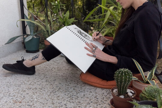 Woman drawing some science fiction sketch