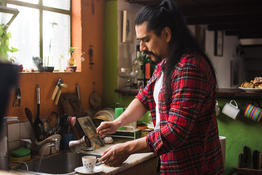 Man making two cups of turkish coffee