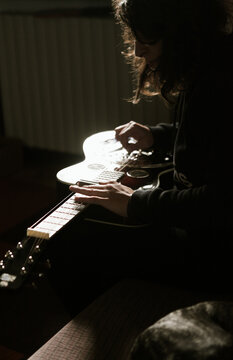 Playing a dobro guitar at home