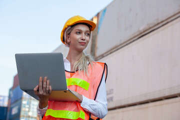 woman working with laptop in cargo container. Containers box from Cargo freight ship for import export. Business logistic concept, Import and export concept