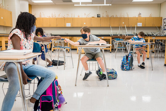 Students with mask playing in class during COVID-19