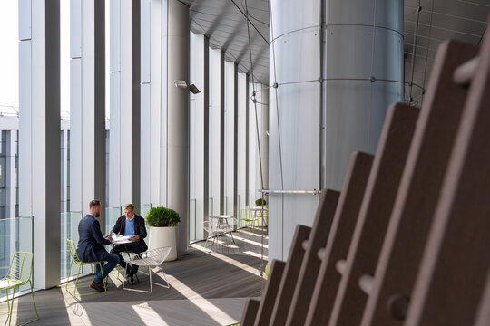 Business Partners Meeting At Modern Office Terrace