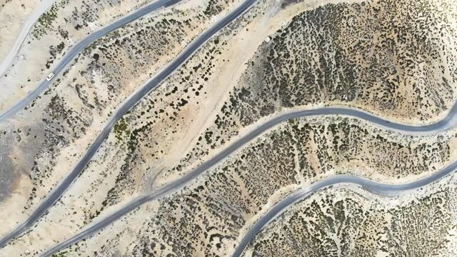 Aerial shot of zig zag roads, full of hairpin turns