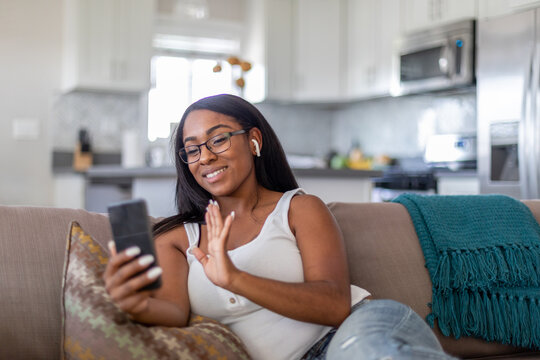 Woman Waves On the Phone