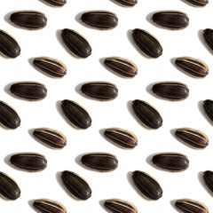 Black sunflower seeds isolated on white background. Raw whole grains