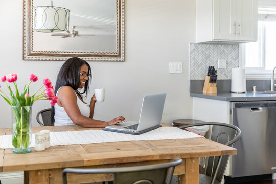 Woman Working on Her Laptop With Coffee