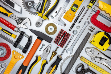assorted work and home renovation tools. diagonal flat lay. concept industrial background