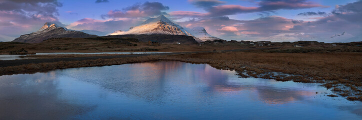 Fototapeta premium Winter sunrise panorama on the coast at Djupivogur, Iceland
