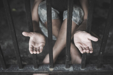 The child was locked in a steel cage, Violence against children, Domestic violence, Stop human trafficking  Concept, stop violence against Women, international women's day