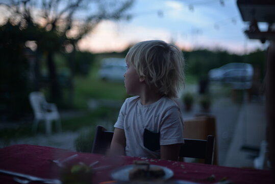 A toddler sitting at the table